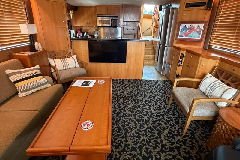 Slide: The Image of Luxurious 1999 Grand Alaskan Pilothouse interior with elegant wood finishes and comfortable seating. - 5