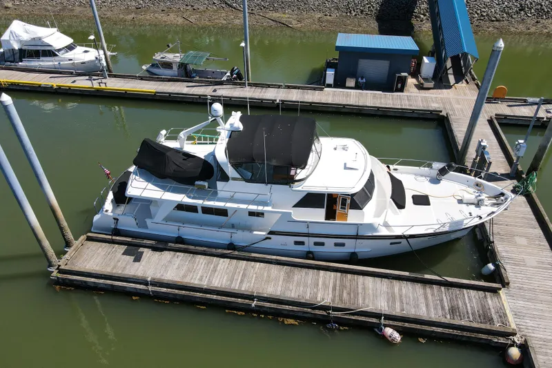 Slide: The Image of Aerial view of 1999 Grand Alaskan Pilothouse yacht docked at marina. - 66