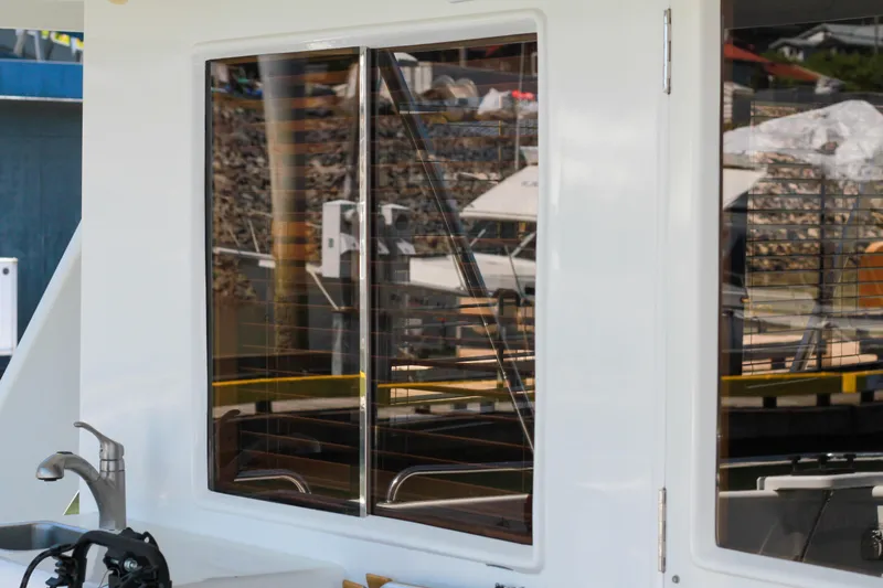 Slide: The Image of 1999 Grand Alaskan Pilothouse yacht window and exterior sink area. - 95