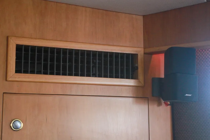 Slide: The Image of Wooden interior of 1999 Grand Alaskan Pilothouse with speaker and vent. - 98