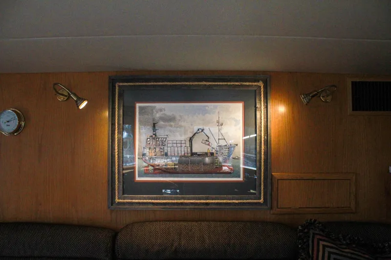Slide: The Image of Framed ship artwork on 1999 Grand Alaskan Pilothouse wooden interior wall. - 99