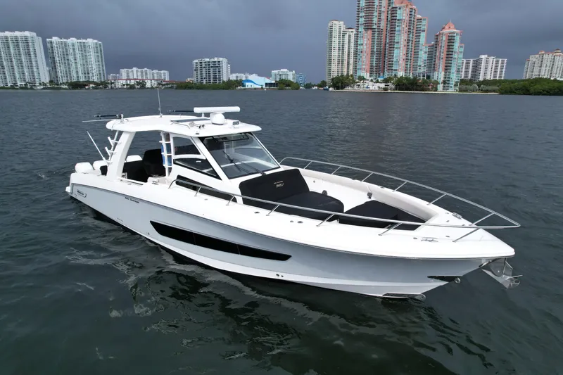 The Image of 2020 Boston Whaler 420 Outrage boat on water with city skyline background. - 0