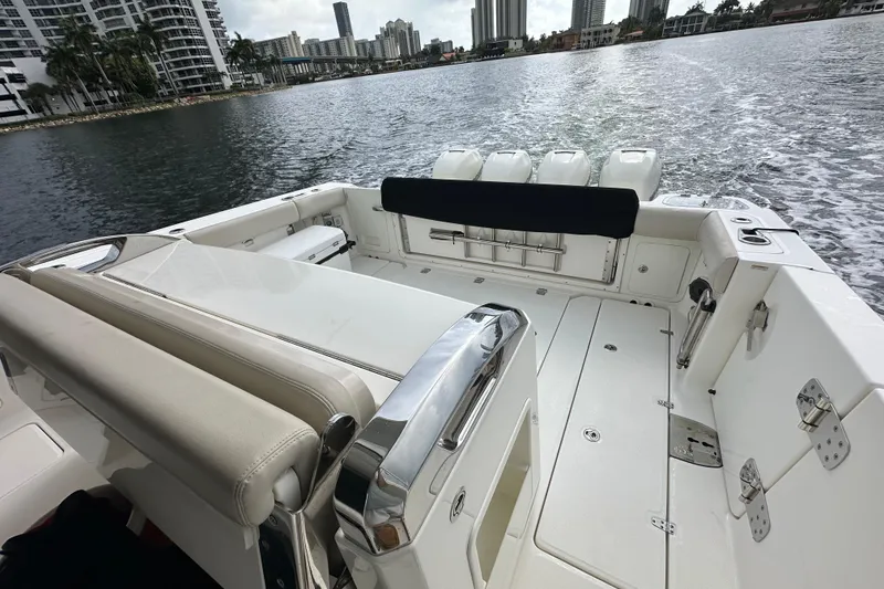 Slide: The Image of 2020 Boston Whaler 420 Outrage boat interior with city skyline in the background. - 13