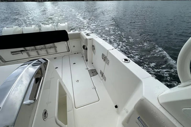 Slide: The Image of 2020 Boston Whaler 420 Outrage boat deck with ocean view and sleek design. - 14