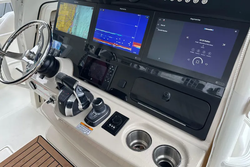 Slide: The Image of 2020 Boston Whaler 420 Outrage helm with advanced navigation and control systems. - 20