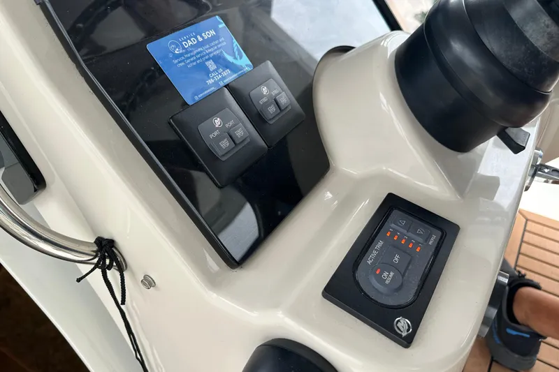Slide: The Image of Control panel of a 2020 Boston Whaler 420 Outrage boat, featuring navigation and system controls. - 30