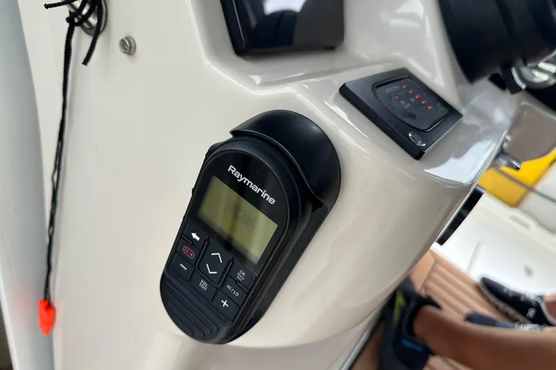 Slide: The Image of Raymarine control panel on 2020 Boston Whaler 420 Outrage boat dashboard. - 32