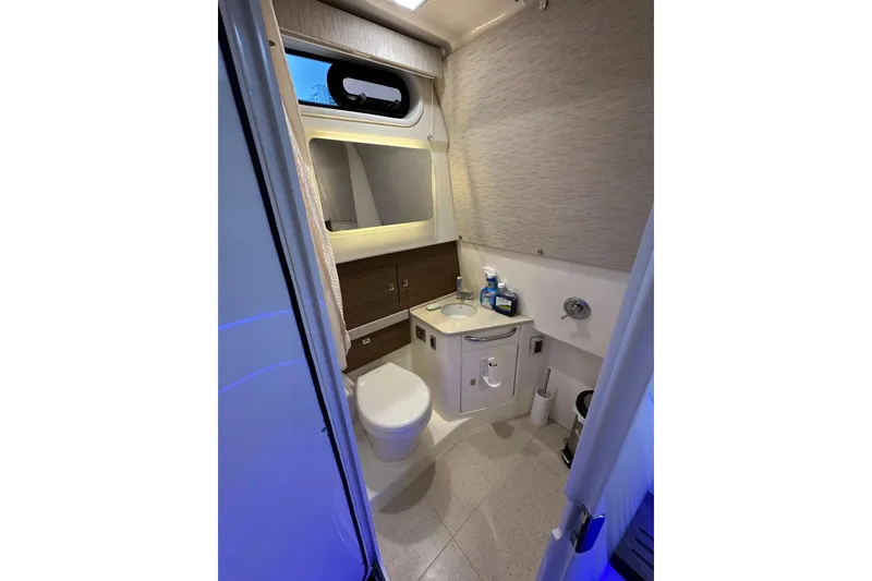 Slide: The Image of 2020 Boston Whaler 420 Outrage bathroom interior with modern fixtures and compact design. - 35