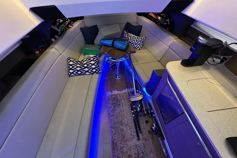 Slide: The Image of Luxurious interior of a 2020 Boston Whaler 420 Outrage with seating and fishing gear. - 36