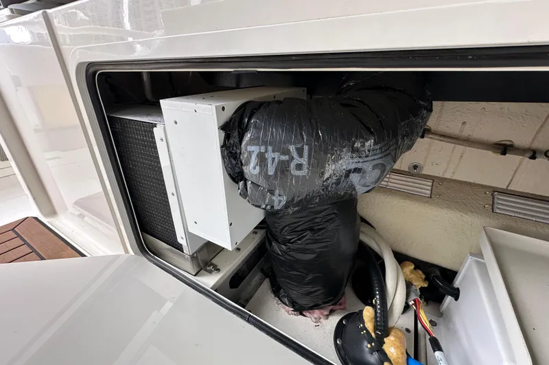 Slide: The Image of Compartment view of a 2020 Boston Whaler 420 Outrage boat's internal components. - 41