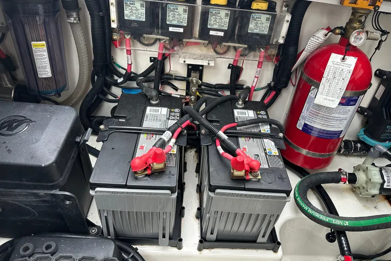 Slide: The Image of Battery compartment of a 2020 Boston Whaler 420 Outrage with fire extinguisher. - 44