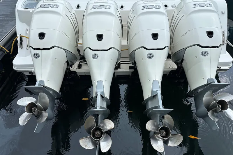 Slide: The Image of Four powerful outboard motors on a 2020 Boston Whaler 420 Outrage boat. - 47