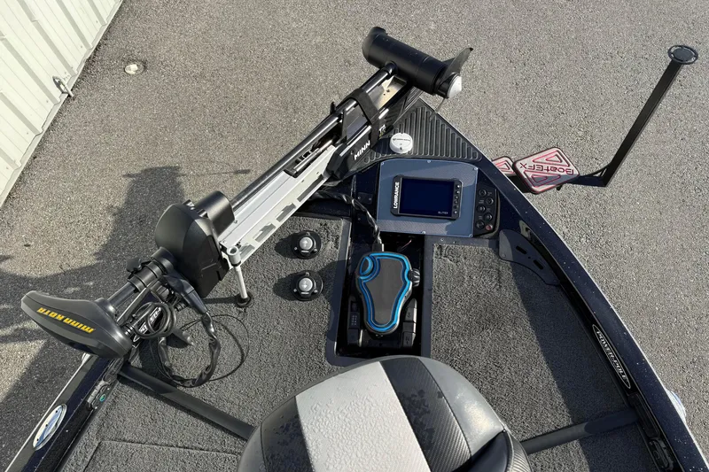 Slide: The Image of 2015 Ranger Z118 Comanche boat dashboard with electronics and trolling motor. - 11