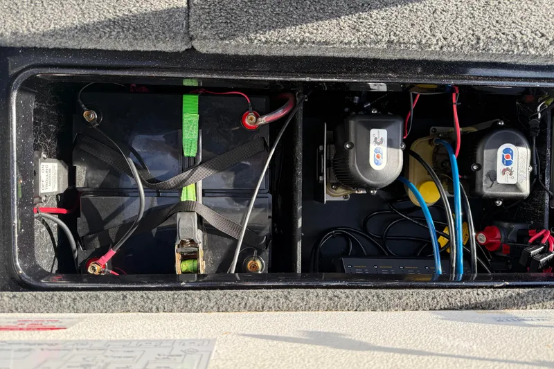 Slide: The Image of Battery compartment of a 2015 Ranger Z118 Comanche boat with wiring and components. - 20