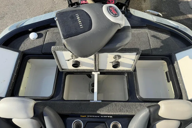 Slide: The Image of 2015 Ranger Z118 Comanche boat interior with open storage compartments and seating. - 21
