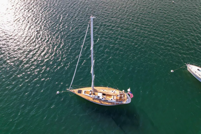 Slide: The Image of Aerial view of a 1990 Baltic 52 sailboat on calm waters. - 61