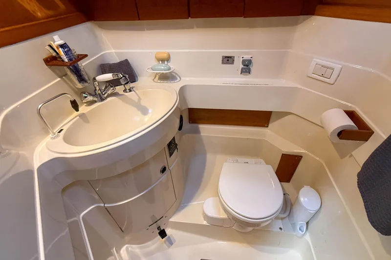 Slide: The Image of Compact bathroom in a 1990 Baltic 52 yacht with sink and toilet. - 39