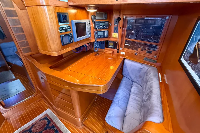 Slide: The Image of Navigation station of a 1990 Baltic 52 yacht with wooden interior and electronic equipment. - 42