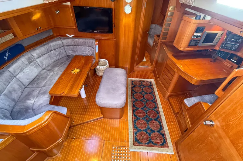 Slide: The Image of Luxurious interior of a 1990 Baltic 52 yacht with wooden furnishings and cozy seating. - 44