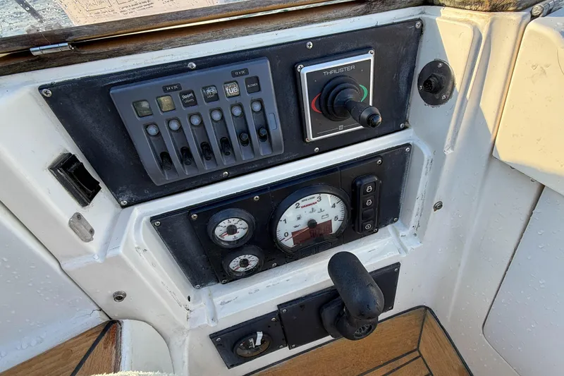 Slide: The Image of Control panel of a 1990 Baltic 52 yacht with gauges and switches. - 48