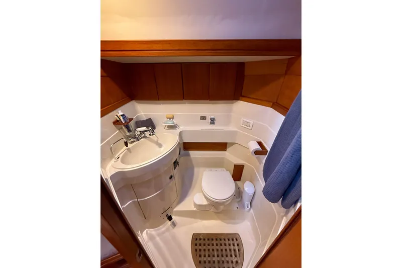 Slide: The Image of Compact bathroom in a 1990 Baltic 52 yacht with wooden cabinetry and modern fixtures. - 40