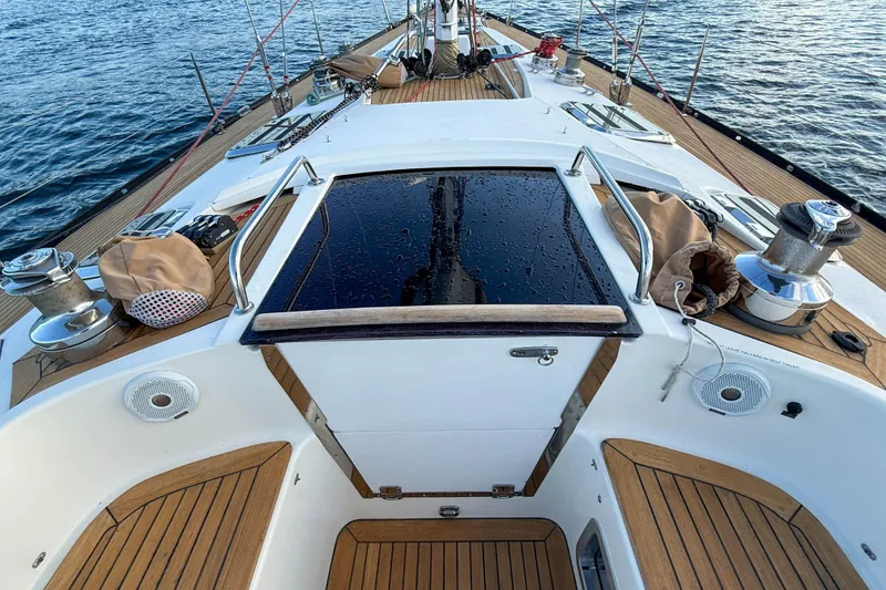 Slide: The Image of Deck view of a 1990 Baltic 52 sailboat with teak finish and winches. - 59