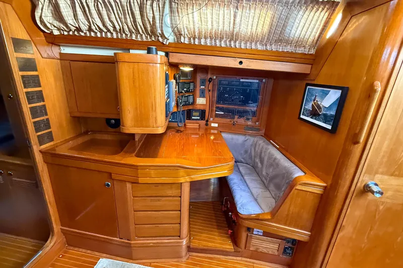 Slide: The Image of Cozy interior of a 1990 Baltic 52 yacht with wooden furnishings and navigation equipment. - 43