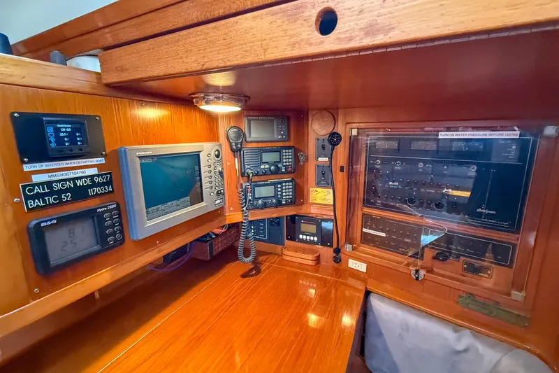 Slide: The Image of Navigation and communication equipment on a 1990 Baltic 52 yacht control panel. - 18