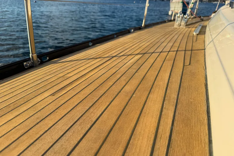 Slide: The Image of Teak deck of a 1990 Baltic 52 yacht with ocean view. - 52