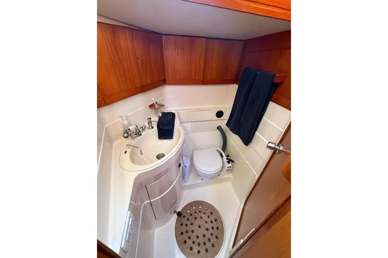 Slide: The Image of Compact bathroom in 1990 Baltic 52 yacht with wooden cabinetry and modern fixtures. - 24