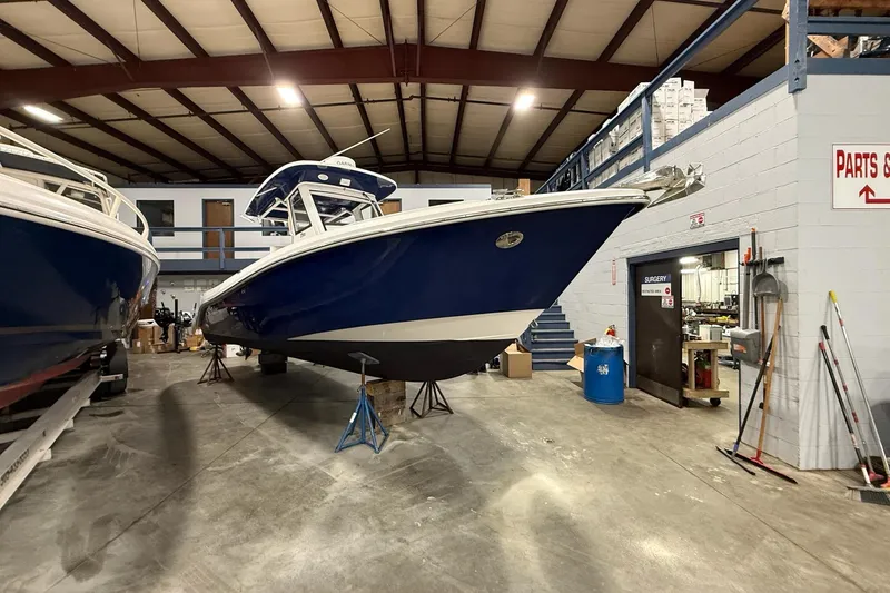 Slide: The Image of 2012 Everglades 275 Center Console boat in indoor storage facility. - 12