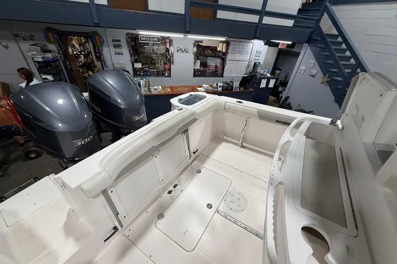 Slide: The Image of 2012 Everglades 275 Center Console boat interior with twin Yamaha 300 engines in a showroom. - 5