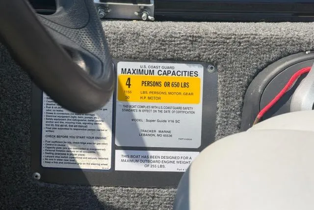 Slide: The Image of 2015 Tracker Super Guide V-16 SC capacity label, showing 4-person or 650 lbs limit. - 12