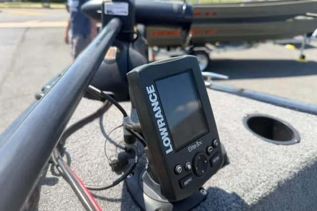 Slide: The Image of Lowrance Elite-3x fish finder on 2015 Tracker Super Guide V-16 SC boat dashboard. - 6