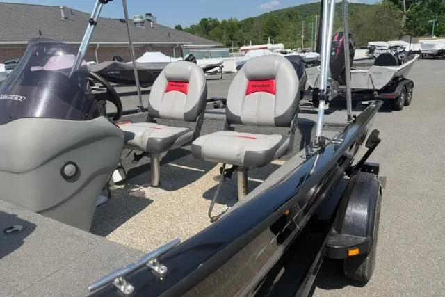 Slide: The Image of 2015 Tracker Super Guide V-16 SC boat with dual seats and steering console. - 9