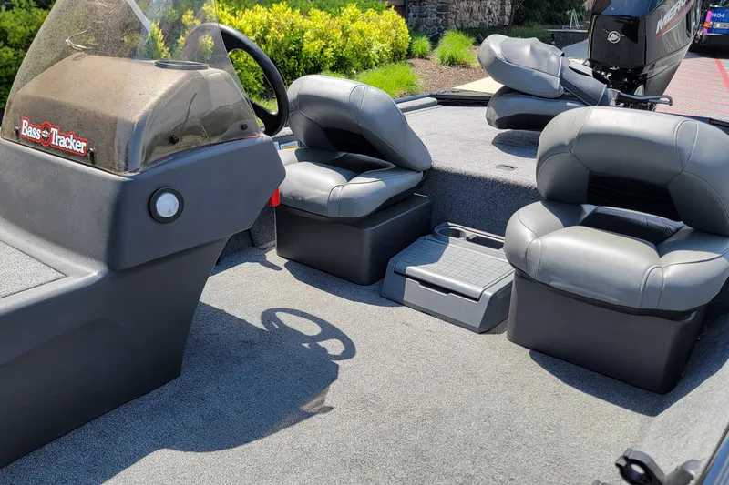 Slide: The Image of 2023 Tracker Bass Tracker Classic XL boat interior with seating and steering console. - 4