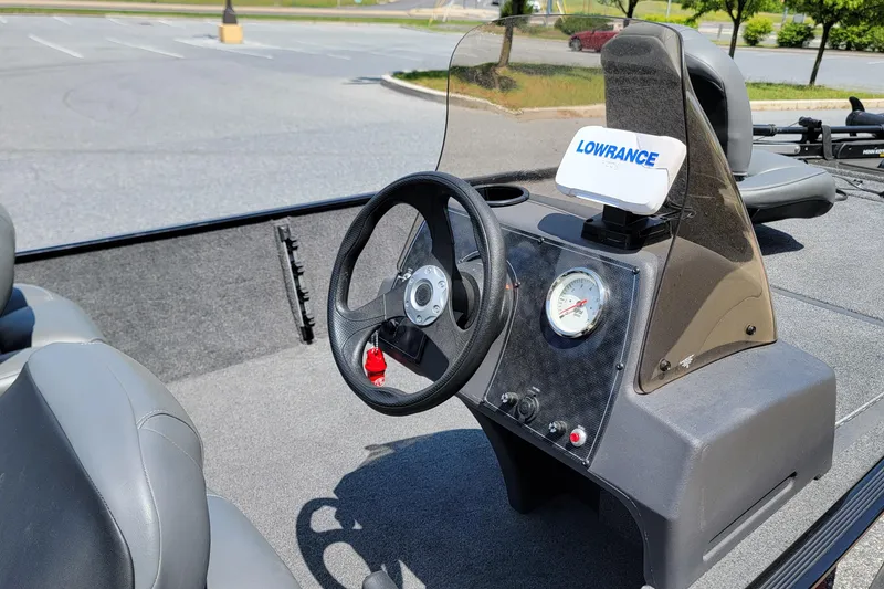 Slide: The Image of 2023 Tracker Bass Tracker Classic XL boat dashboard with steering wheel and Lowrance device. - 5