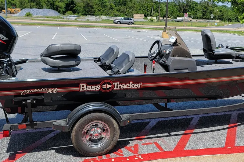 Slide: The Image of 2023 Tracker Bass Tracker Classic XL boat on trailer in parking lot. - 6