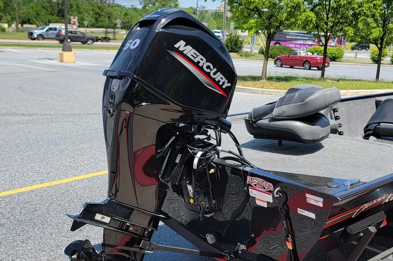 Slide: The Image of 2023 Tracker Bass Tracker Classic XL with Mercury outboard motor in parking lot. - 7
