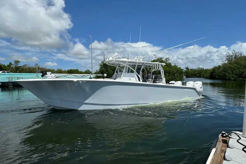 The Image of 2024 SeaHunter 41 CTS boat cruising on a sunny day with clear skies. - 1