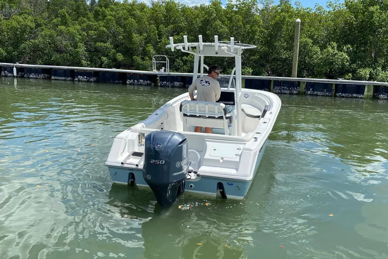 Slide: The Image of 2023 Tidewater 220 LXF boat on water, featuring Yamaha 250 outboard motor. - 14