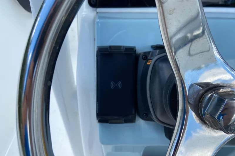 Slide: The Image of Steering wheel and control panel of 2023 Tidewater 220 LXF boat. - 26