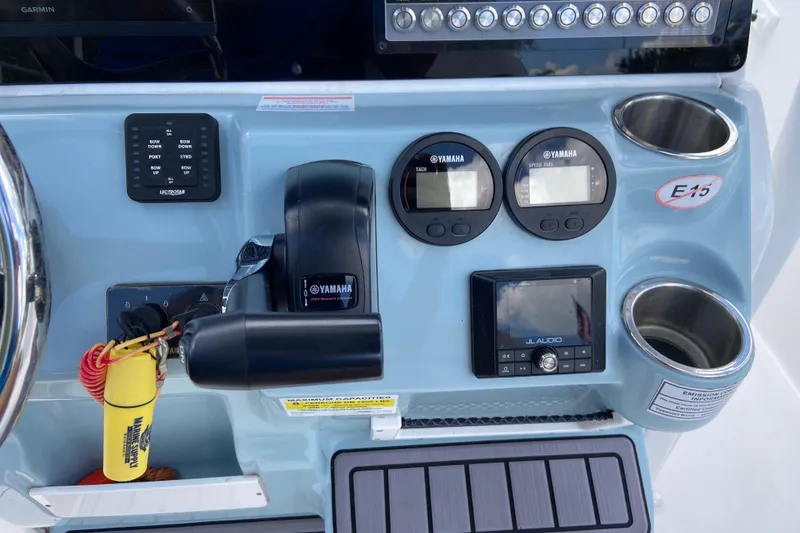 Slide: The Image of Control panel of 2023 Tidewater 220 LXF boat with Yamaha gauges and JL Audio system. - 27