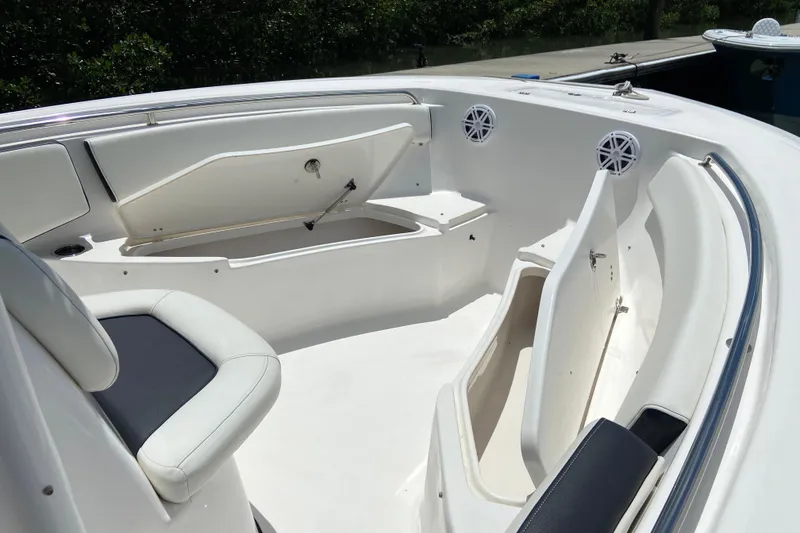 Slide: The Image of 2023 Tidewater 220 LXF boat interior with seating and storage compartments. - 32