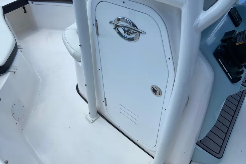 Slide: The Image of Interior of 2023 Tidewater 220 LXF with white storage compartment. - 33
