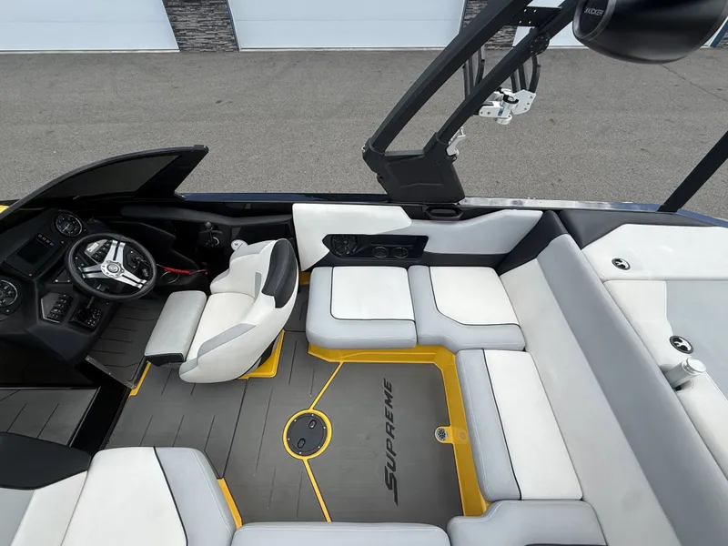 Slide: The Image of Interior of a 2018 Supreme S202 boat with gray and white seating. - 12