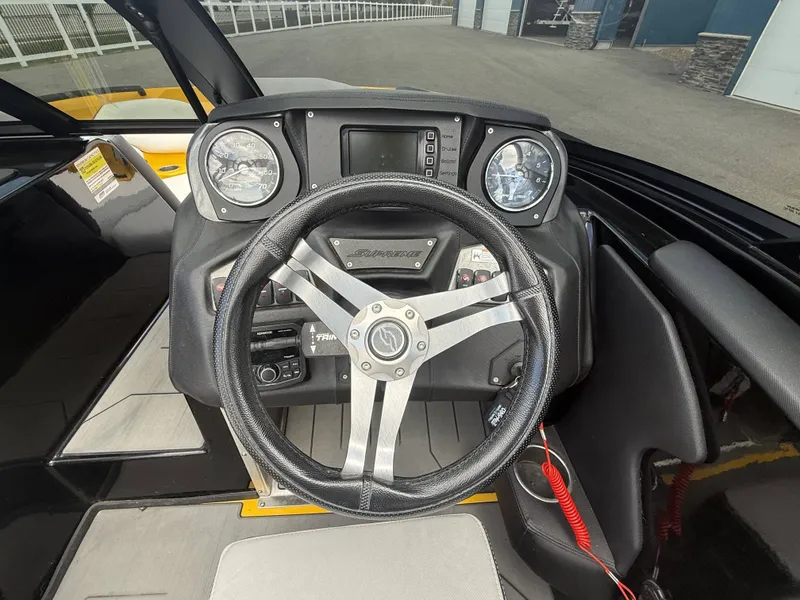 Slide: The Image of Steering wheel of a 2018 Supreme S202 boat. - 13