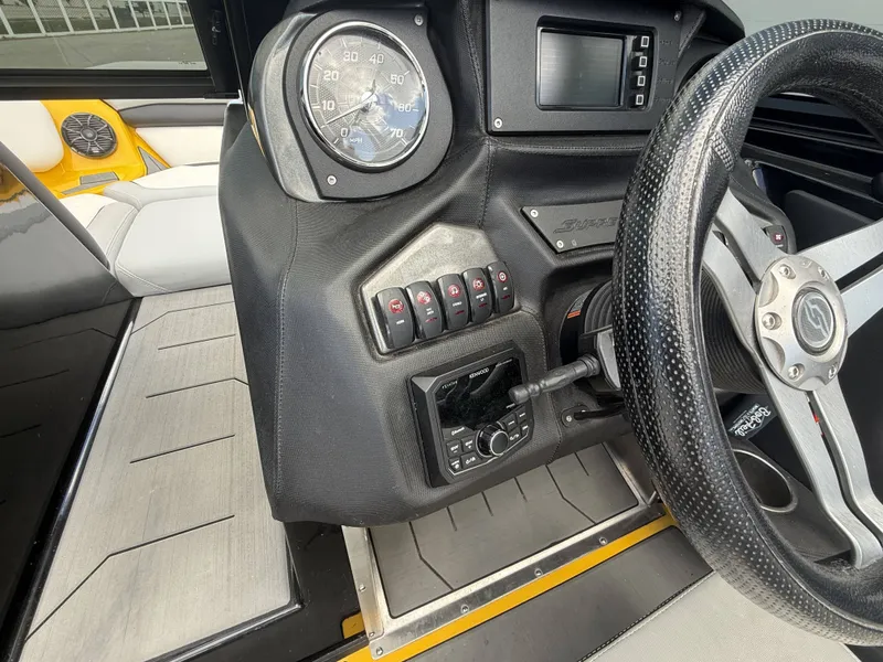 Slide: The Image of Interior of a 2018 Supreme S202 boat with steering wheel and dashboard. - 14