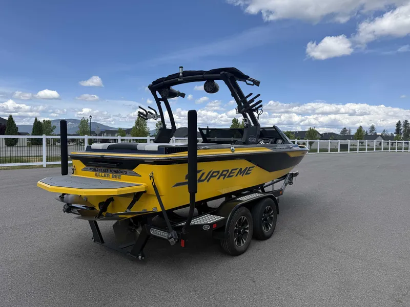Slide: The Image of Yellow Supreme S202 boat on trailer, 2018 model. - 5