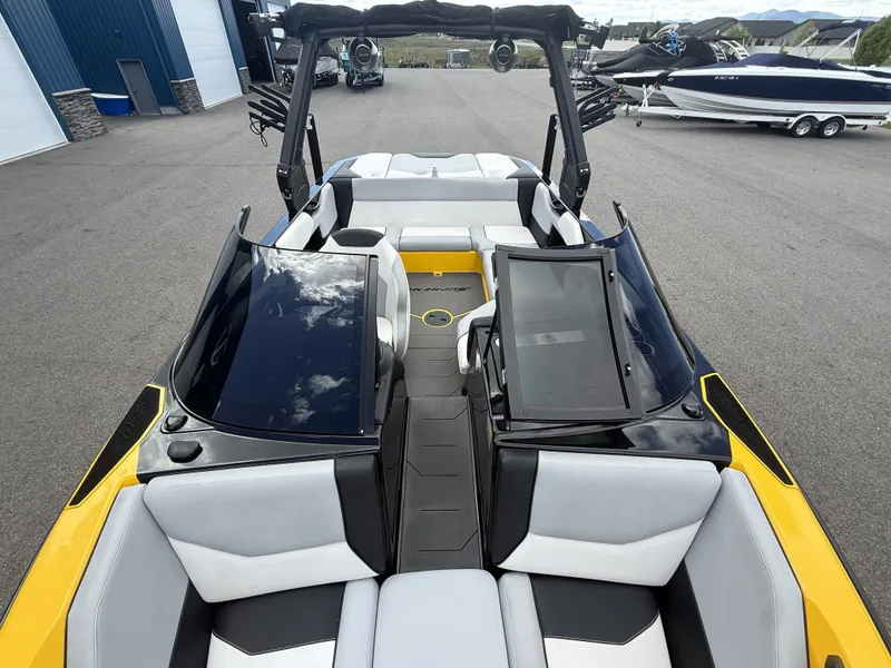 Slide: The Image of 2018 Supreme S202 boat with modern design and yellow accents. - 9